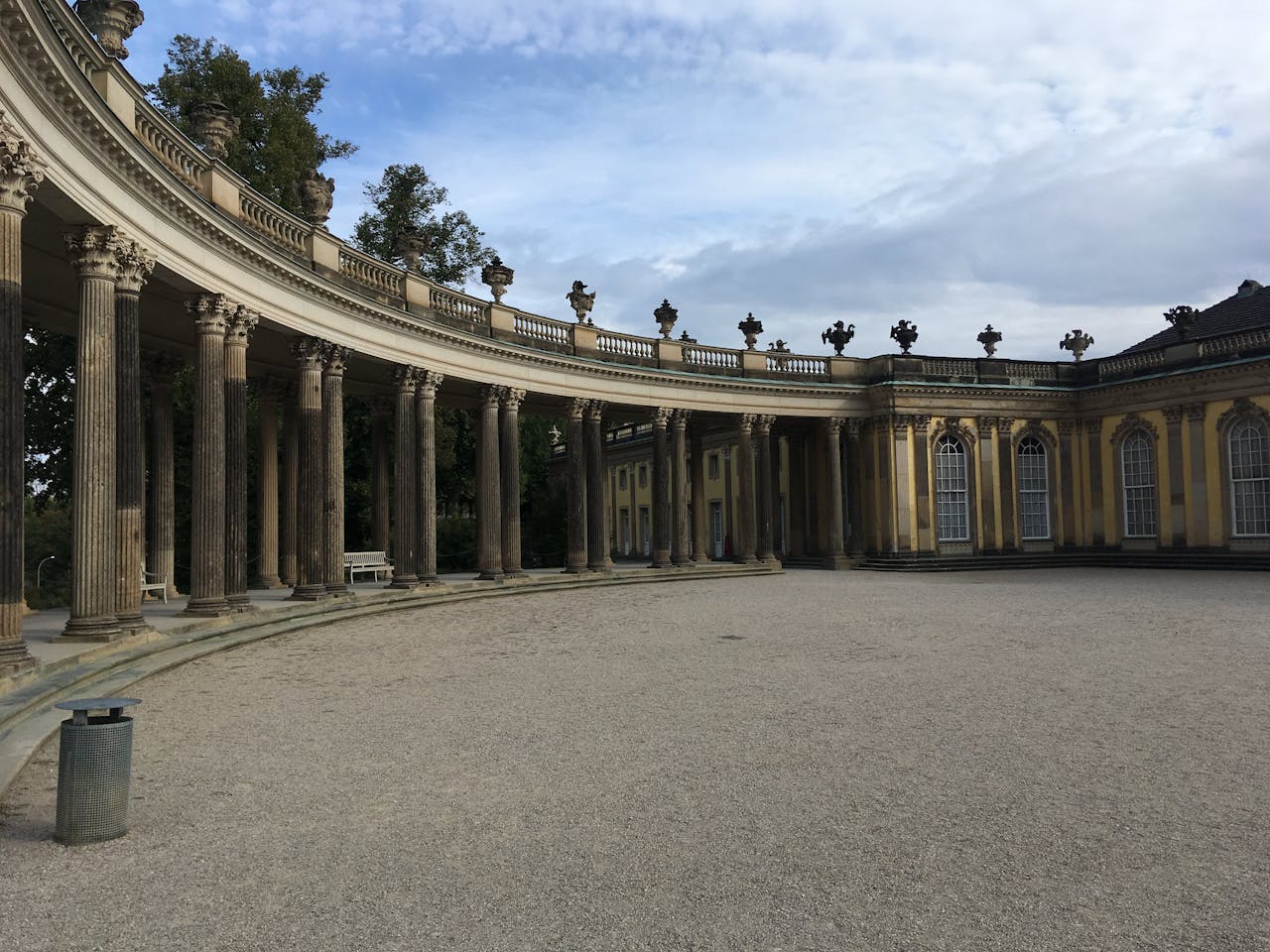 Colonnade and palace wing at Sanssouci Park in Potsdam, a day trip from Berlin