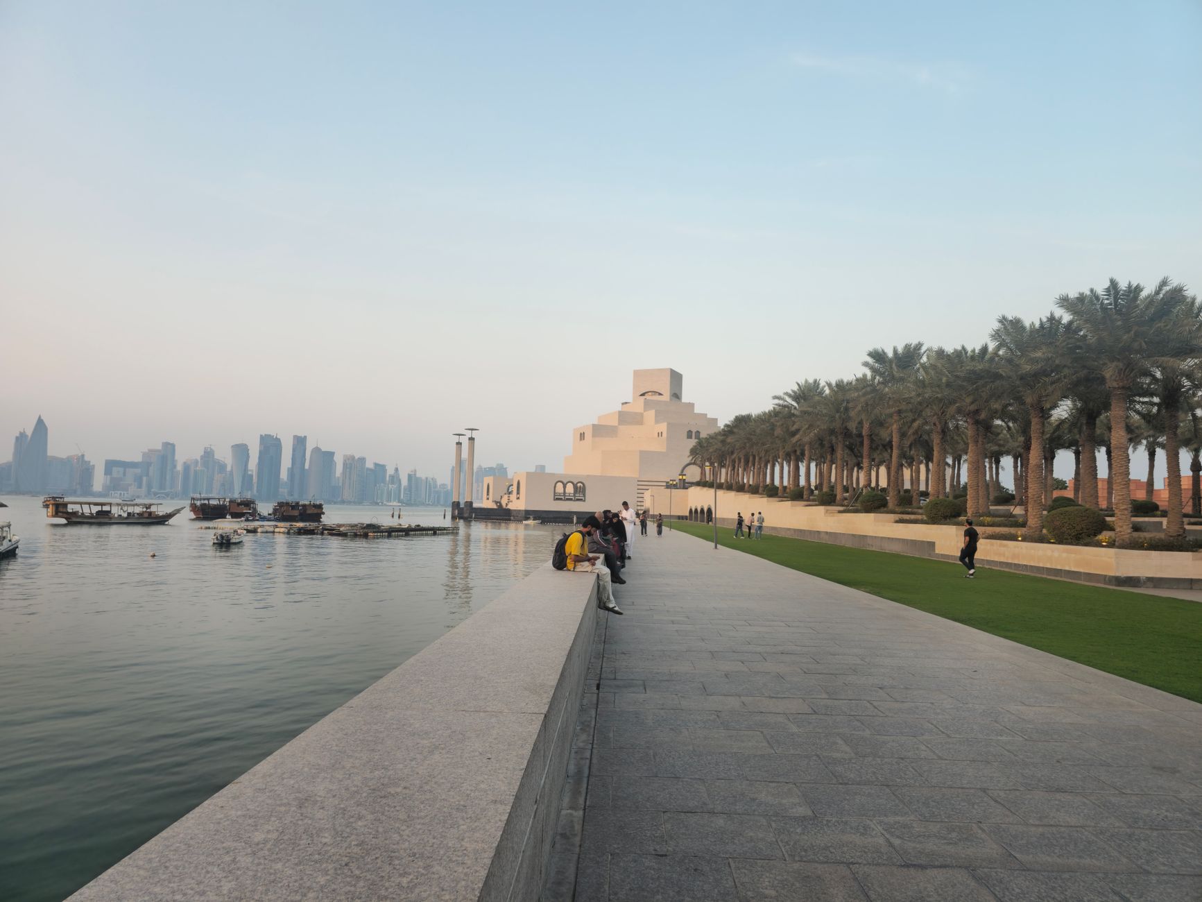 The Corniche waterfront promenade in Doha, Qatar, with the skyline behind