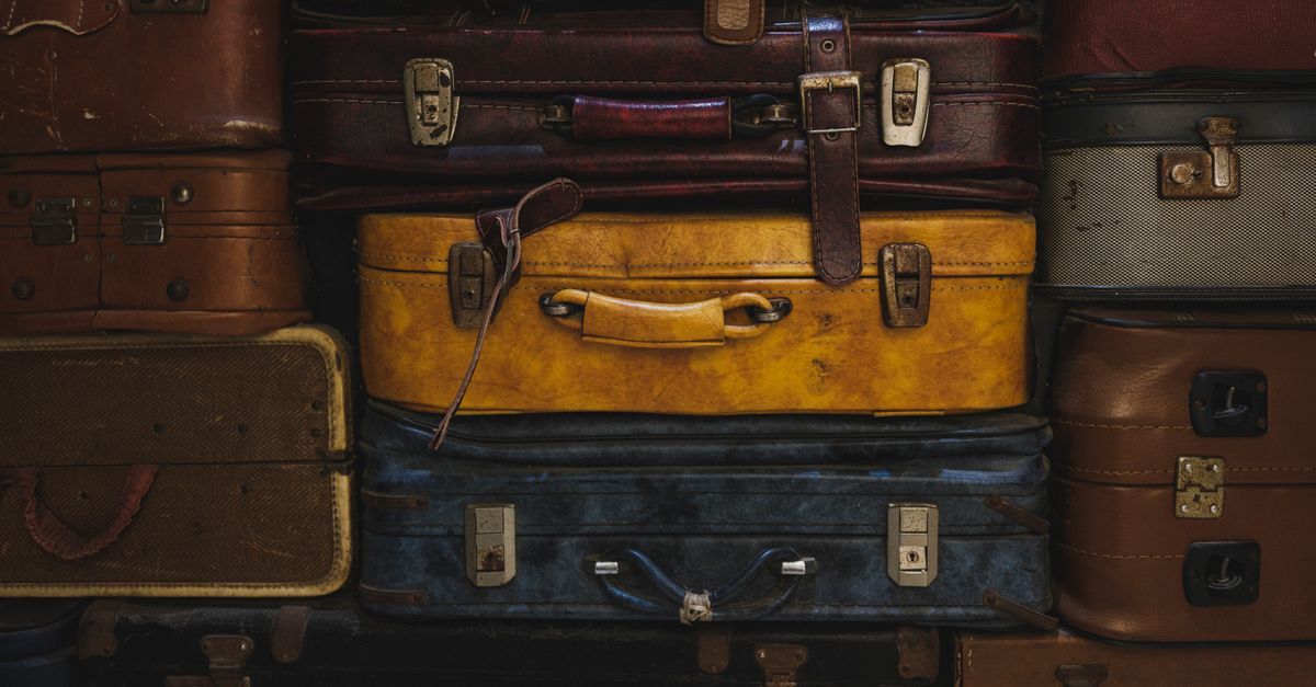 Suitcases lined up at an airport